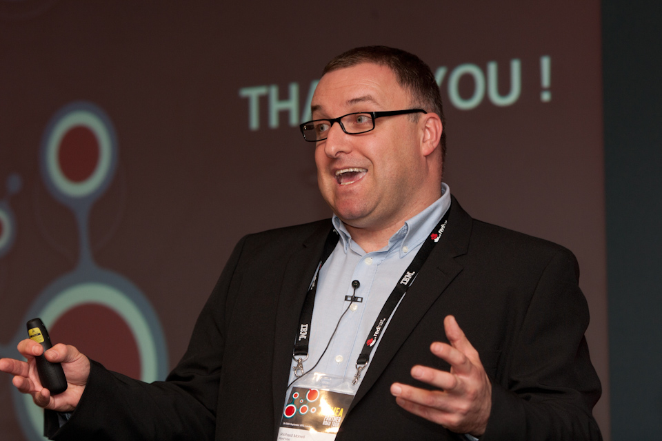 Richard speaking at Partner Tour Richard on stage, photo courtesy of Phil Rudge